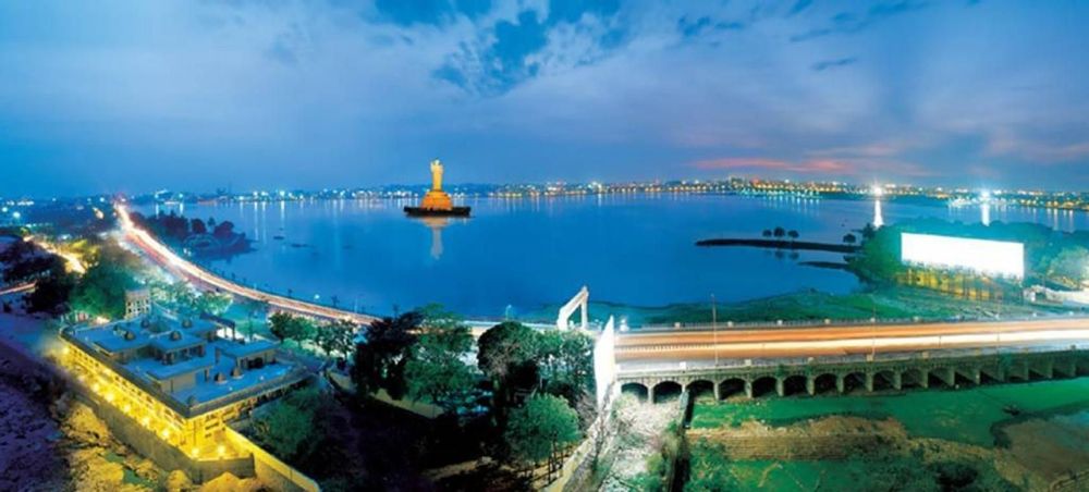 Illuminated Telangana Secretariat and Martyrs Memorial during an evening Hyderabad walking tour
