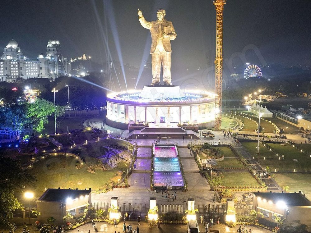 Travelers viewing the Dr B R Ambedkar Statue during a private Hussain Sagar Lake walking tour