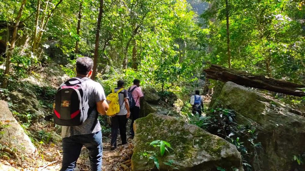 Travelers trekking through Nallamala forest towards the source-listed fort during day two