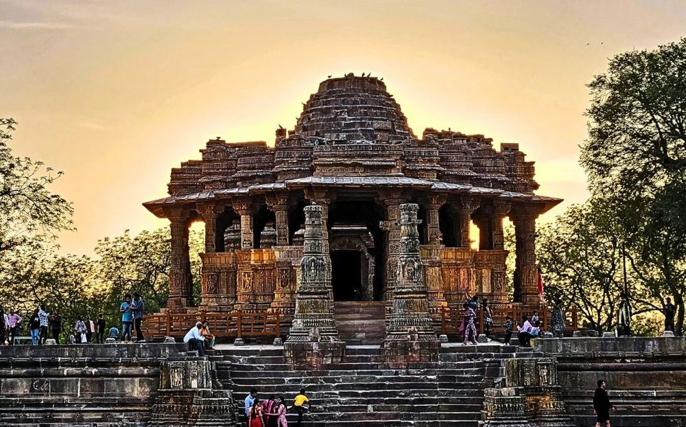 Visitors exploring the carved stone halls of Modhera Sun Temple on a private Gujarat day tour