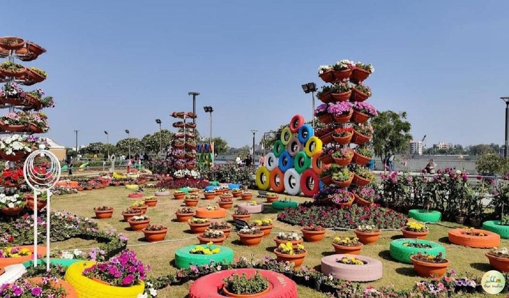 Seasonal flowers and walking paths at Riverfront Flower Park in Ahmedabad