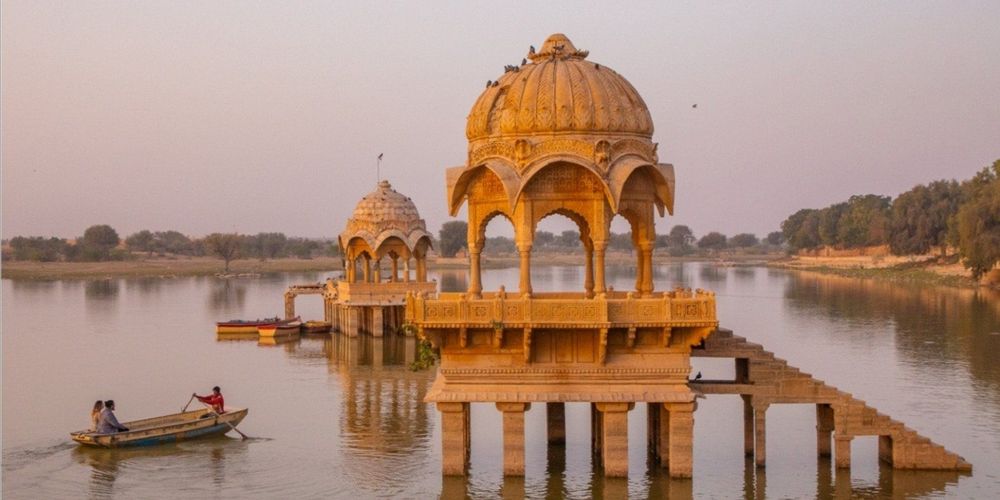 Travelers watching sunset at Vyas Chhatri during a private Jaisalmer Golden City tour