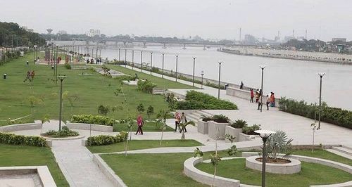 People walking, jogging and cycling beside Sabarmati Riverfront on a winter morning
