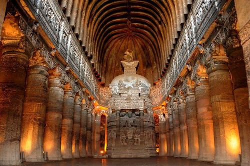 Travelers exploring Karla Caves with an English guide during a Lonavala tour from Mumbai